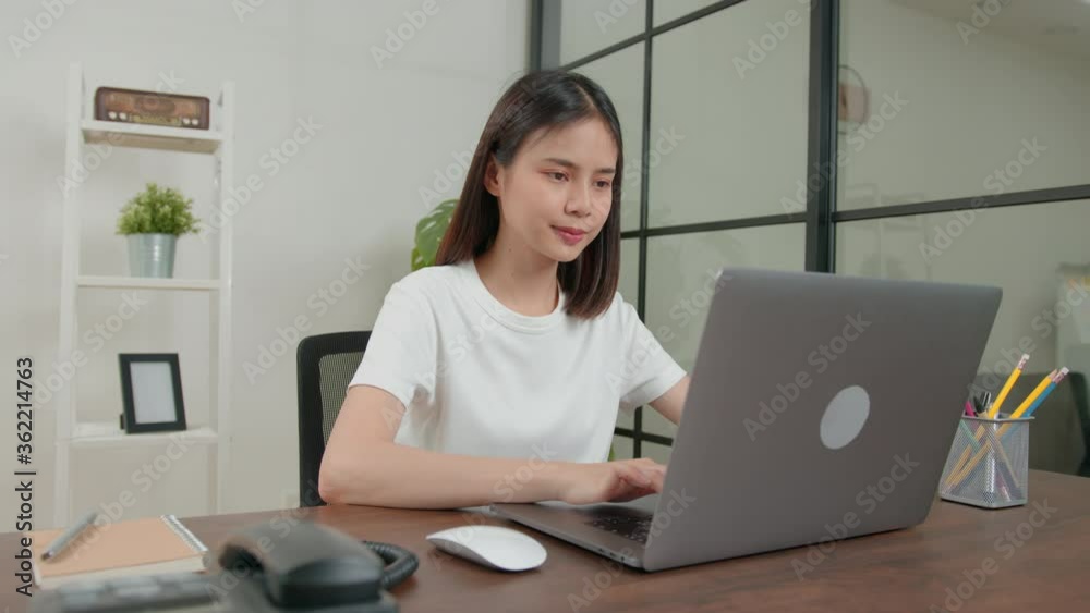 Startup small business concept, young Asian woman owner talking on the telephone with customers about ordering products. Startup small business concept, young Asian woman owner talking on the telephone with customers about ordering products.