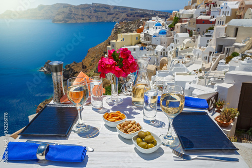 Fototapeta Naklejka Na Ścianę i Meble -  White wine and snacks by the sea in Greece