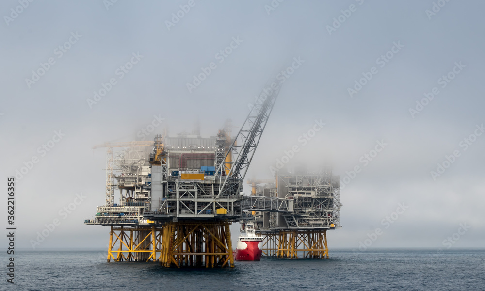 Fototapeta premium Offshore vessel at oil platform