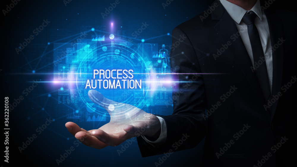 Man hand holding PROCESS AUTOMATION inscription, technology concept