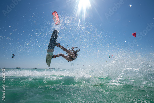 Photography Kite girl rides in the ocean clear water
