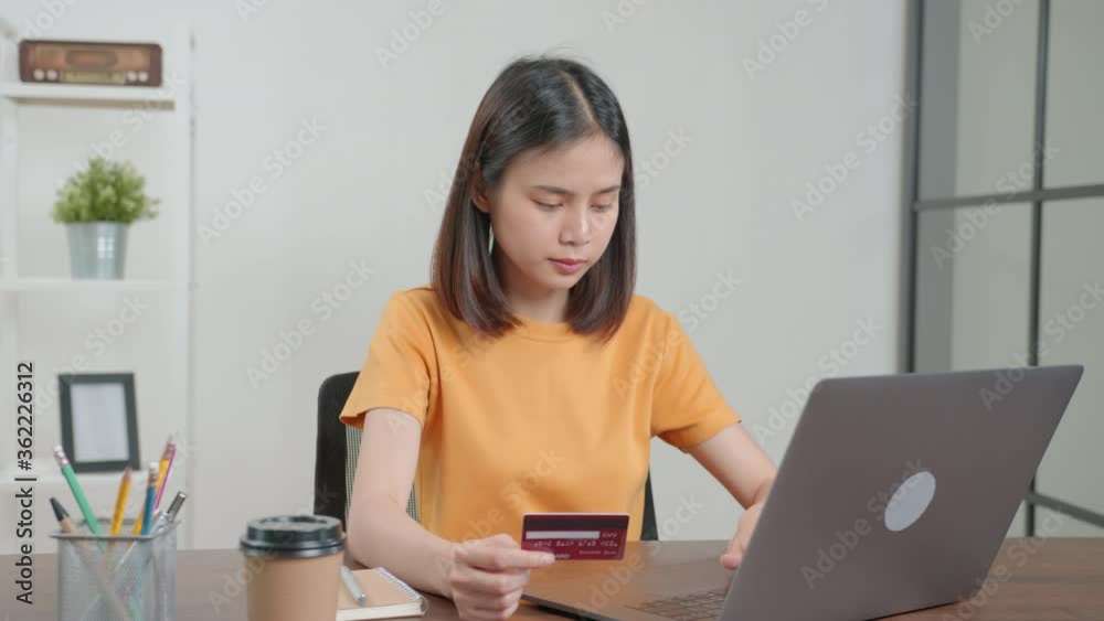 woman holding credit card and using digital laptop with shopping online. woman holding credit card and using digital laptop with shopping online.