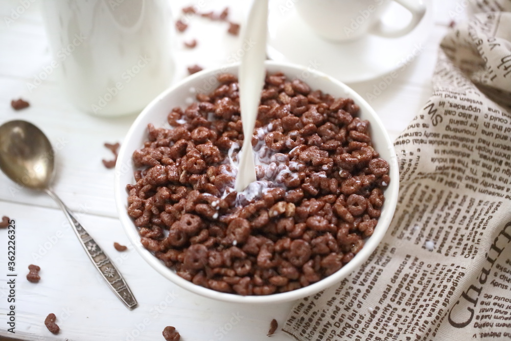 Fototapeta premium Milk is poured into chocolate balls