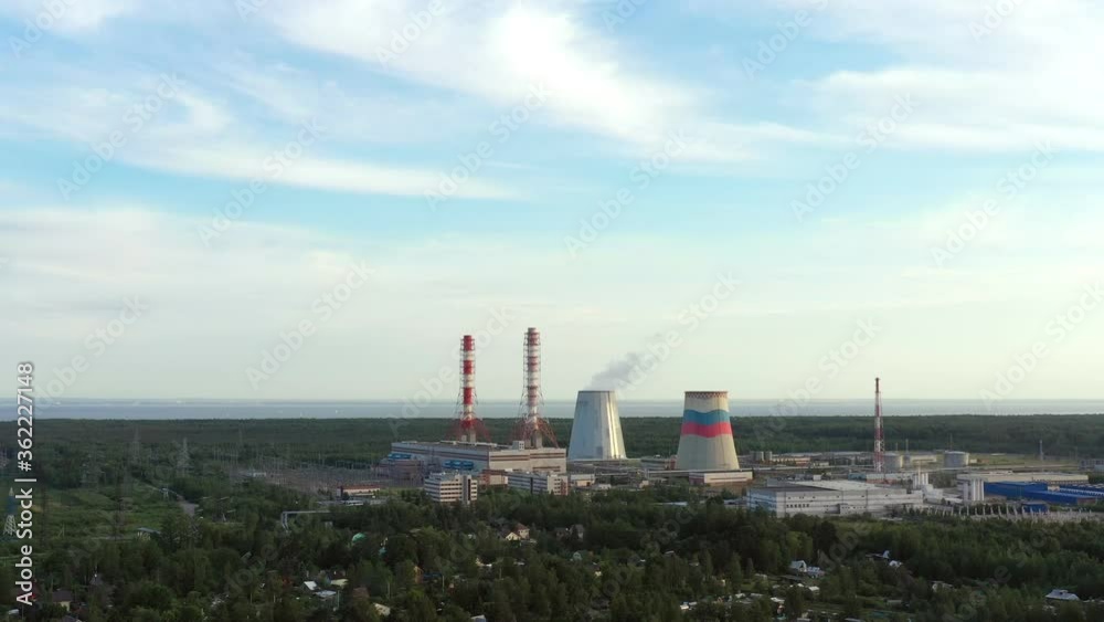 Smoking cooling pipes at power plant. Aerial view from copter Smoking cooling pipes at power plant. Aerial view from copter