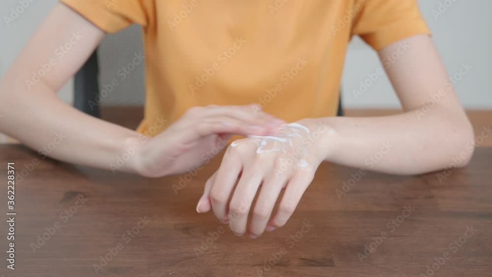 woman hand holding and applying moisturiser, Body lotion. woman hand holding and applying moisturiser, Body lotion.
