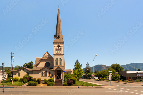 Newman United Methodist Church in downtown Grants Pass. The evolving rainbow flag above the entrance shows loyalty to the LGBTQ movement photo