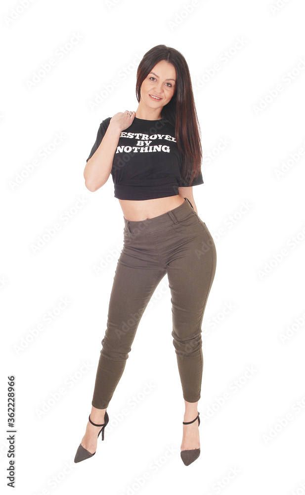 Lovely young woman standing in olive pants and a black top