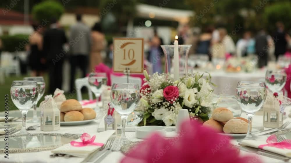 dinner wedding decoration white table
preparation hotel garden flowers close up. Cinematic save the date wedding clip