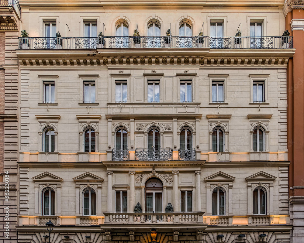 illuminated vintage building facade windows pattern, Rome Italy