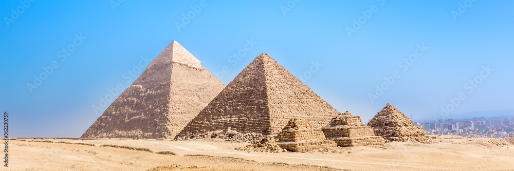The pyramids at Giza in Egypt. Web banner in panoramic view.