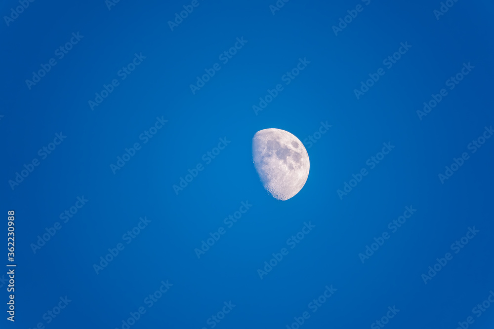 Beautiful half moon on the blue clear sky Beautiful half moon on the blue clear sky