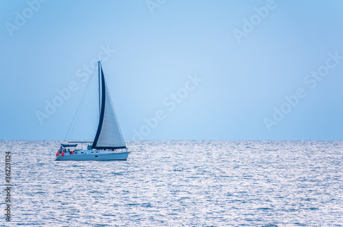 Sailing yacht in the blue calm sea. © Dmitrii Potashkin