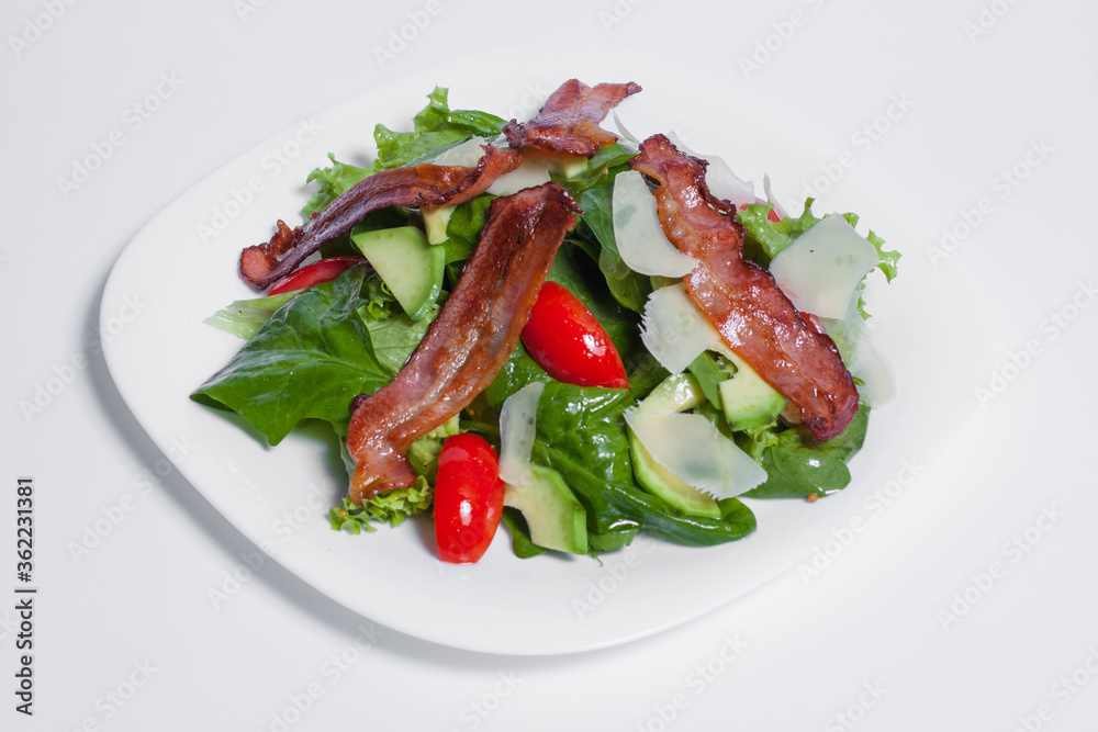 tasty green fresh salad with bacon isolated tasty green fresh salad with bacon isolated