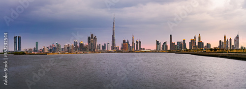 Sunset skyline panorama of Dubai with reflection  UAE