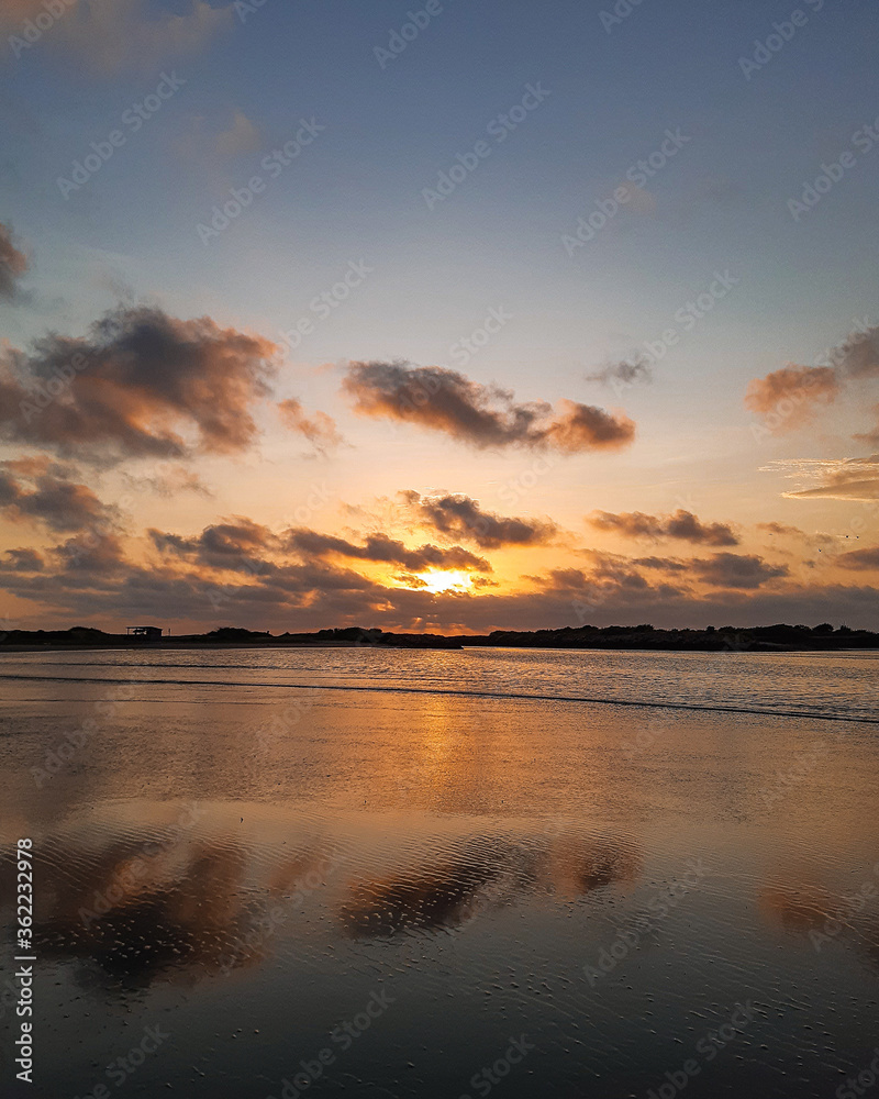 Fototapeta premium Sunset Beach View With Mountains