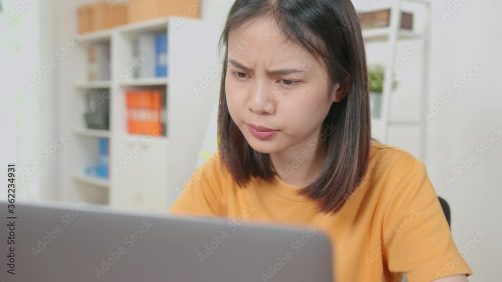 Asian business women feeling headache from hard work and from using the computer for a long time in the desk office room. Asian business women feeling headache from hard work and from using the computer for a long time in the desk office room.