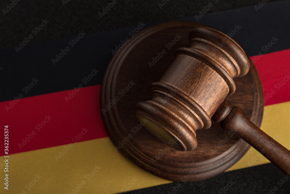 Judges hammer and flag of Germany. Law of Germany. Violation of rights