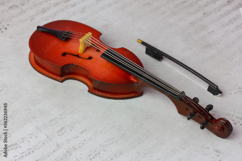 Fototapeta premium miniature toy contrabass with a bow 