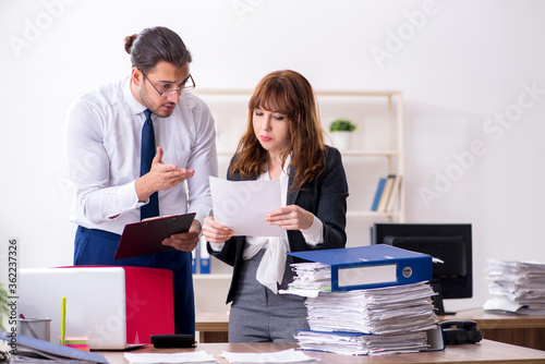 Two employees working in the office © Elnur