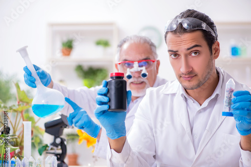 Two chemists working in the lab