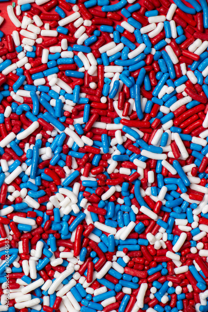 Red, White, and Blue Sprinkles on Red Background Red, White, and Blue Sprinkles on Red Background