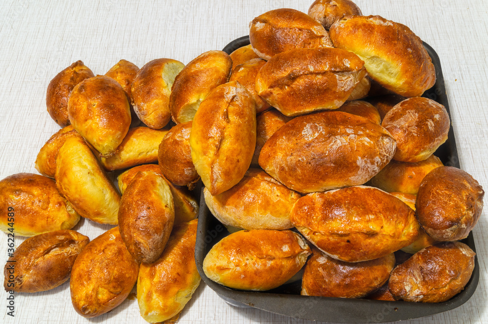 Homemade baked pies with different fillings, Russian baking tradition. Homemade baked pies with different fillings, Russian baking tradition.
