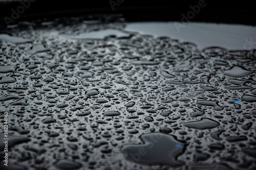 Drops is on metallic surface after rain © Yulia Grass