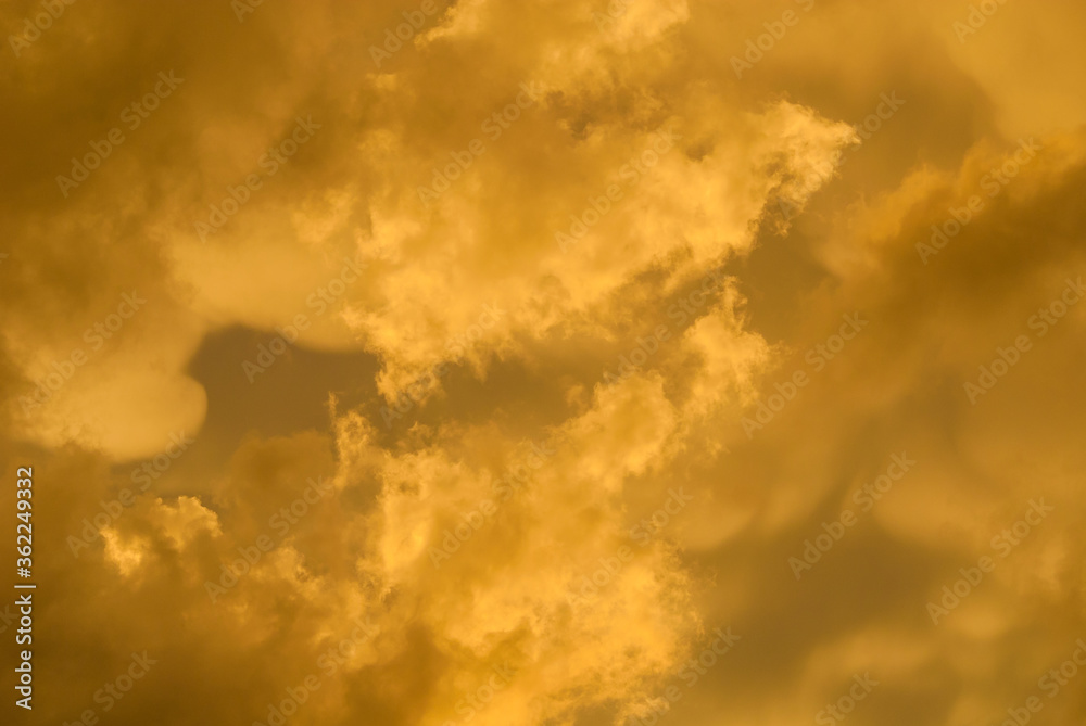 Sunset golden sky with clouds as background