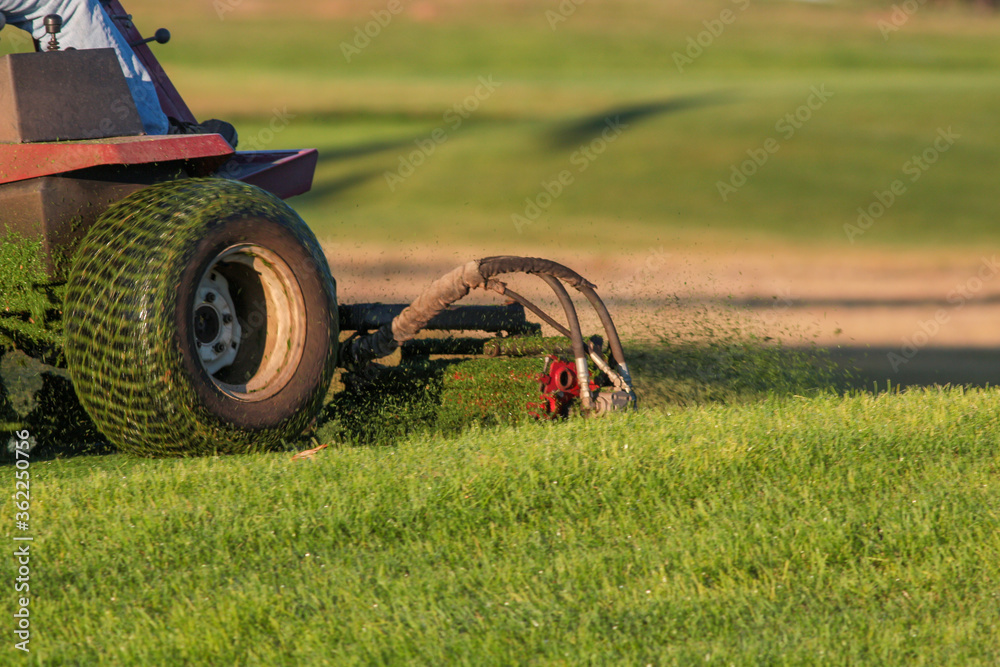 Fototapeta premium Cutting Grass Golf Course