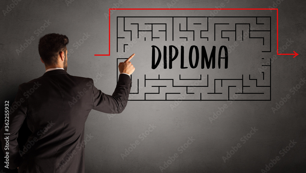 businessman drawing maze with DIPLOMA inscription, business education concept businessman drawing maze with DIPLOMA inscription, business education concept