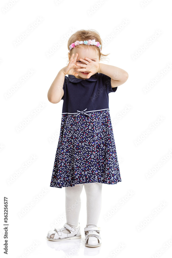 Happy little child girl playing peekaboo over white Happy little child girl playing peekaboo over white