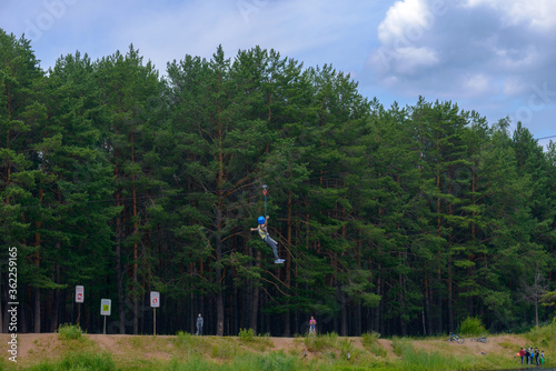 hildren climbing trees. Rope park. Child is a climber. Cables are installed. Balancer and rope bridges. Rope Park-mountaineering center of the forest Park. Russia. Tatarstan. 01. 07. 2020