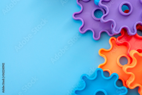 Canvas-taulu Teamwork and solidarity concept with photograph of connected colorful plastic to