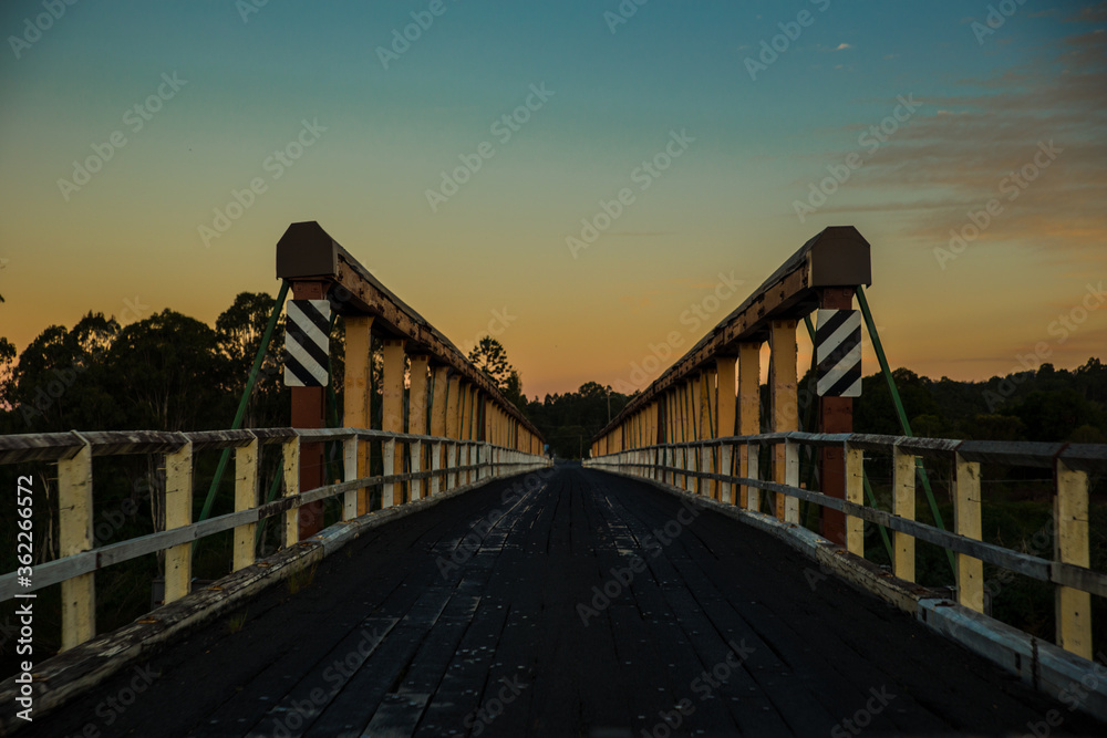 Classic bridge during sunset middle of the road Classic bridge during sunset middle of the road