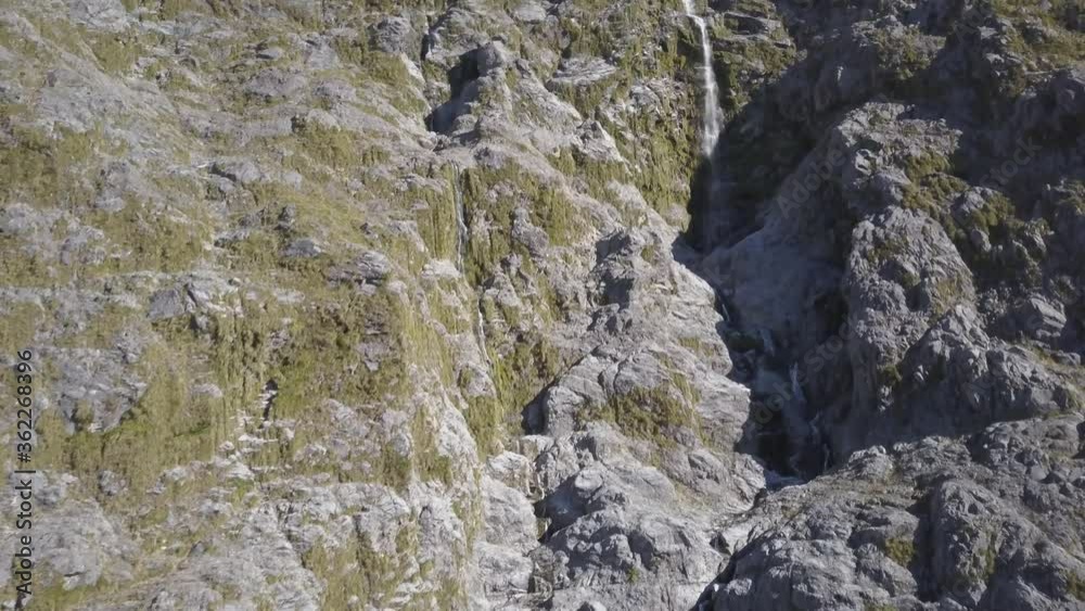Aerial of long waterfall panning down