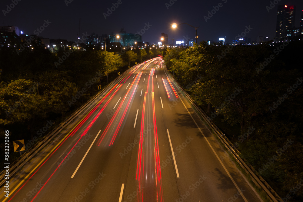 Light trajectory created by a car running at night