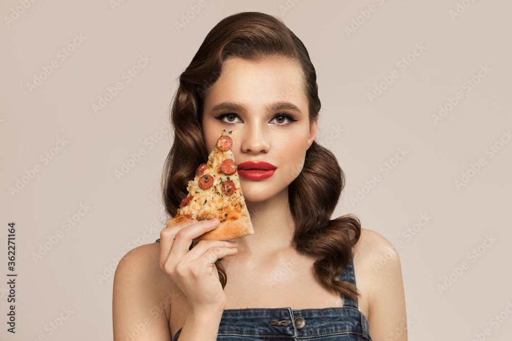 Pin-up woman holding pizza in hand Pin-up woman holding pizza in hand