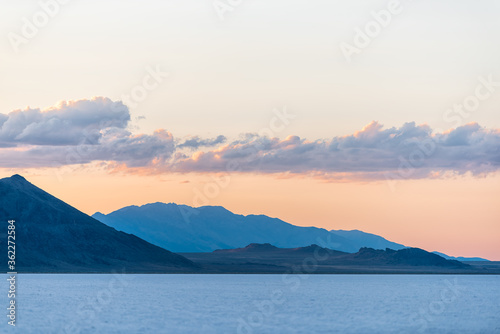Bonneville Salt Flats basin colorful blue red twilight silhouette mountain view after sunset near Salt Lake City, Utah with clouds