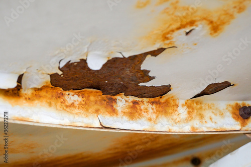 traces of corrosion on metal, peeling peeling rusty paint