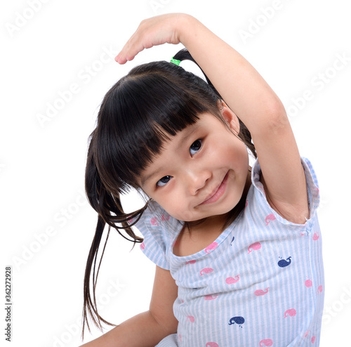 Foto Little girl hold her hand above a head