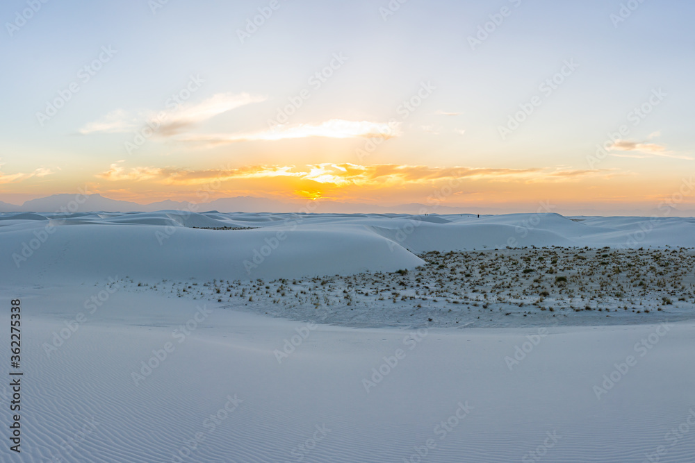 White sands dunes national monument park colorful view in New Mexico with horizon at sunset with silhouette of Organ Mountains
