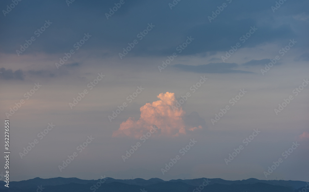 A beautiful fire cloud in the blue sky at dusk