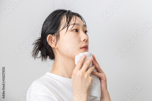 A pure girl washing her face