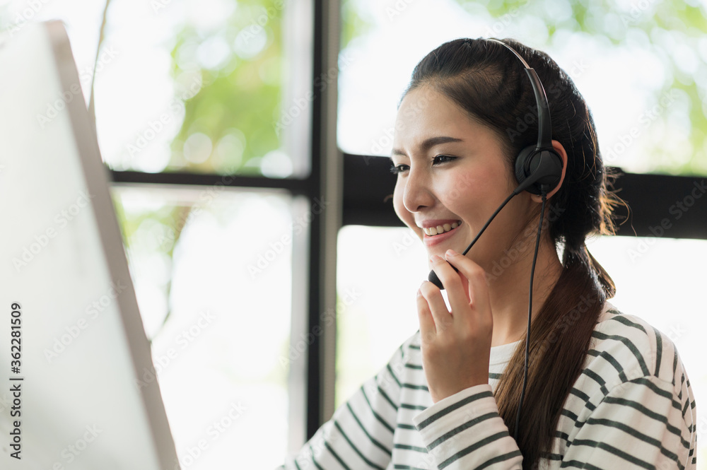 Young business asian woman working call centre customer service agents. Business female support operator with computer and headset in office. Young business asian woman working call centre customer service agents. Business female support operator with computer and headset in office.
