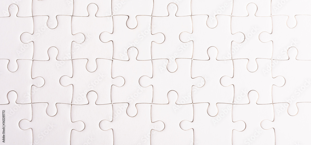 Top view flat lay of paper plain full white jigsaw puzzle game texture background, quiz calculation concept Top view flat lay of paper plain full white jigsaw puzzle game texture background, quiz calculation concept