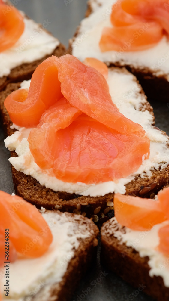 Appetizing Salmon and soft Cheese on Fresh Bread. toast with salmon Appetizing Salmon and soft Cheese on Fresh Bread. toast with salmon
