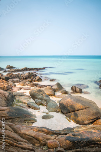 rock on the beach seascape long exposure