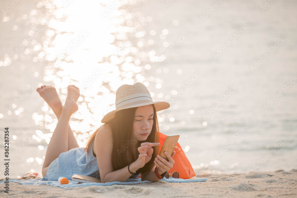 woman enjoy use smartphone  on the beach
