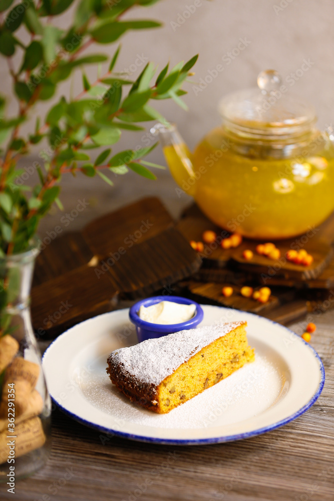 Different varieties of tea in teapots and delicious pastries Different varieties of tea in teapots and delicious pastries