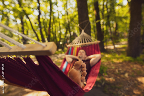 Male legs chill out lying on hammock © antgor